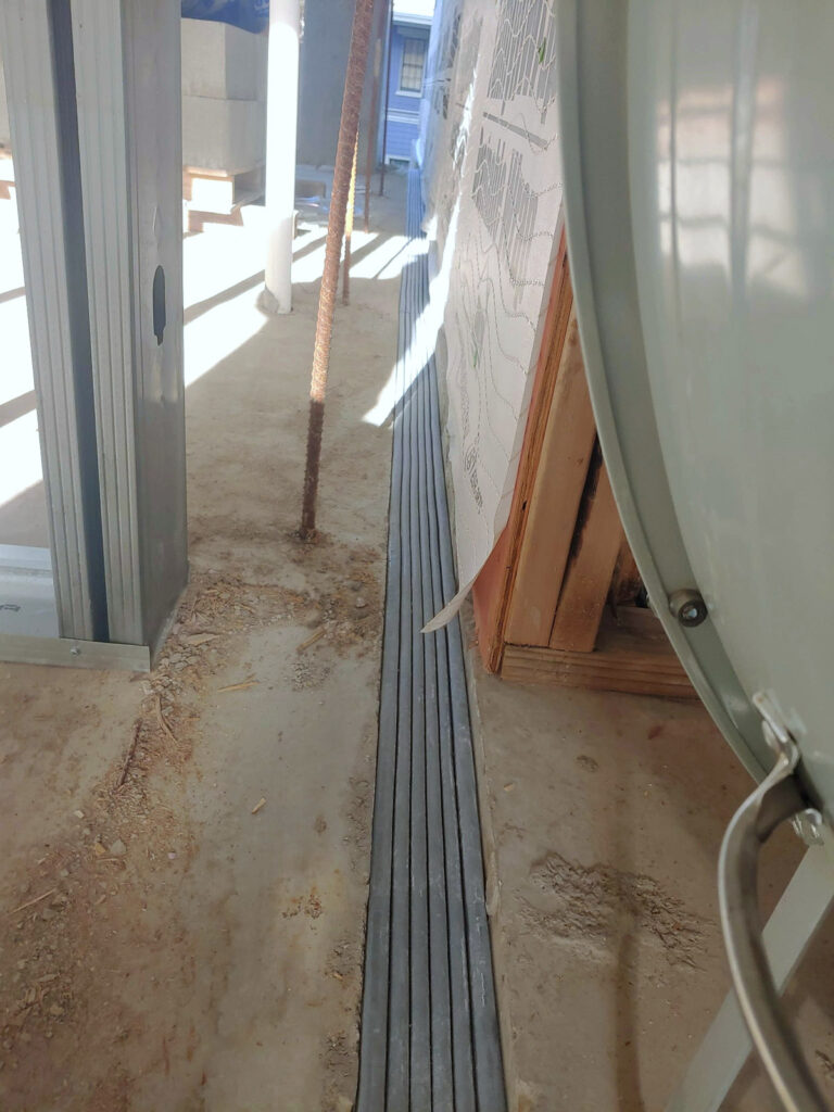 Long expansion-joint cover along an interior floor edge"