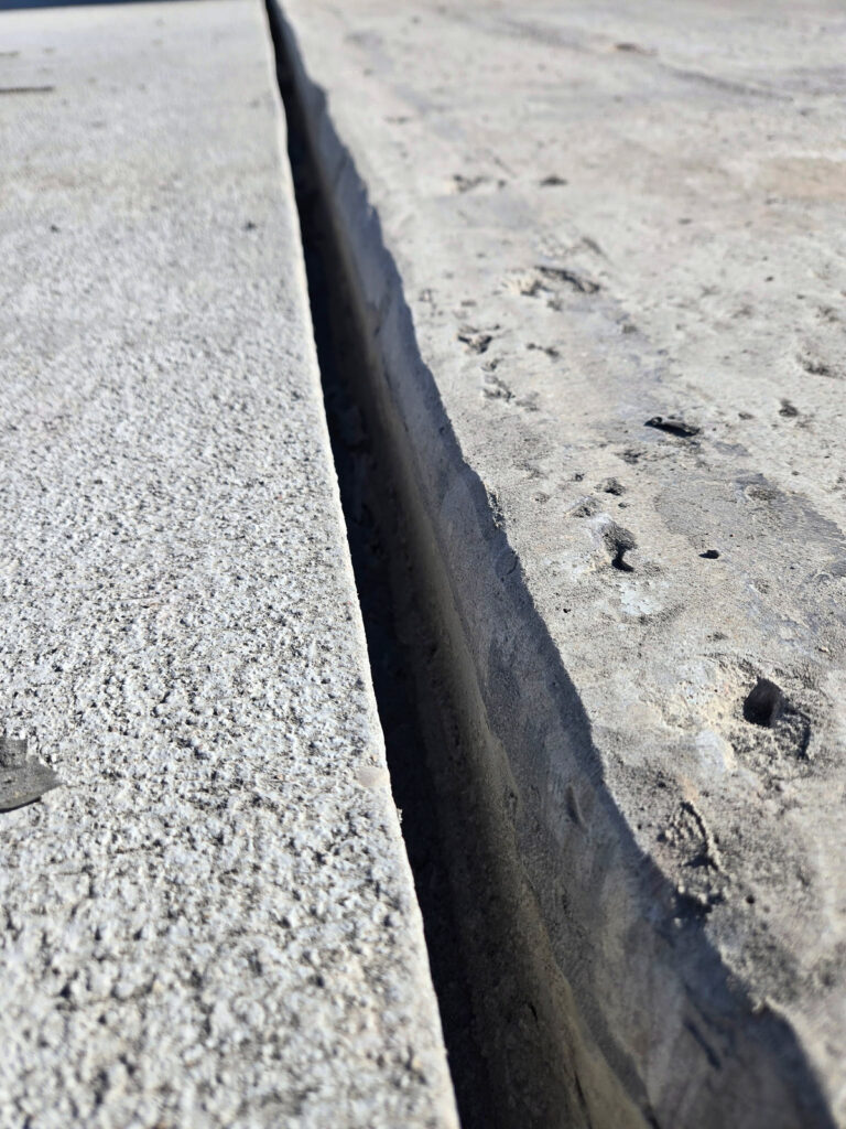 Close view of an open joint between concrete surfaces"