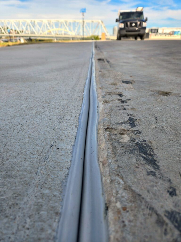 Long view along an exterior deck expansion-joint profile"