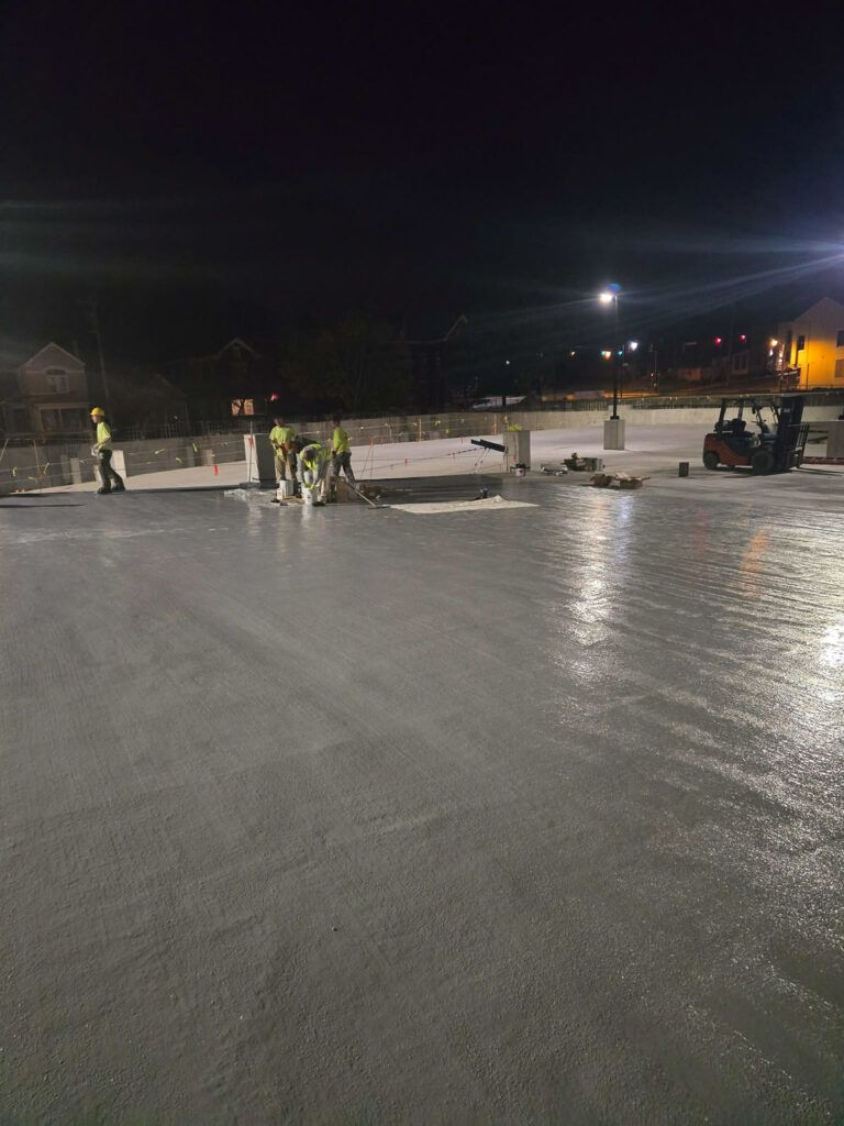 Exterior concrete deck during night work"