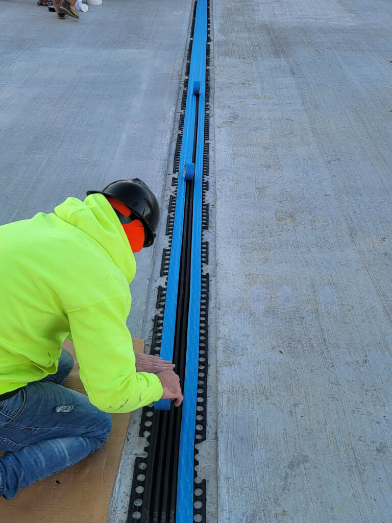 Installing an expansion-joint profile in a concrete deck"